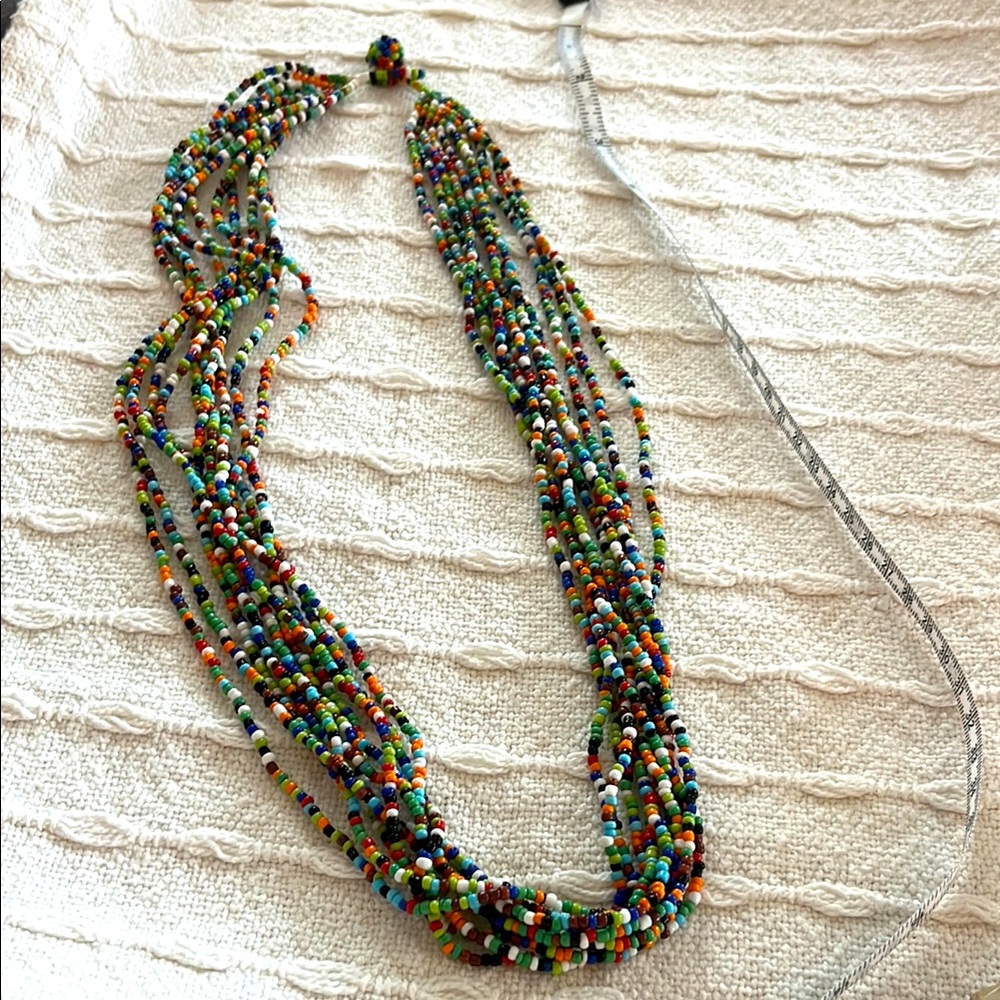 Hippie 10 strand “love beads” in perfect condition. 28” total length.